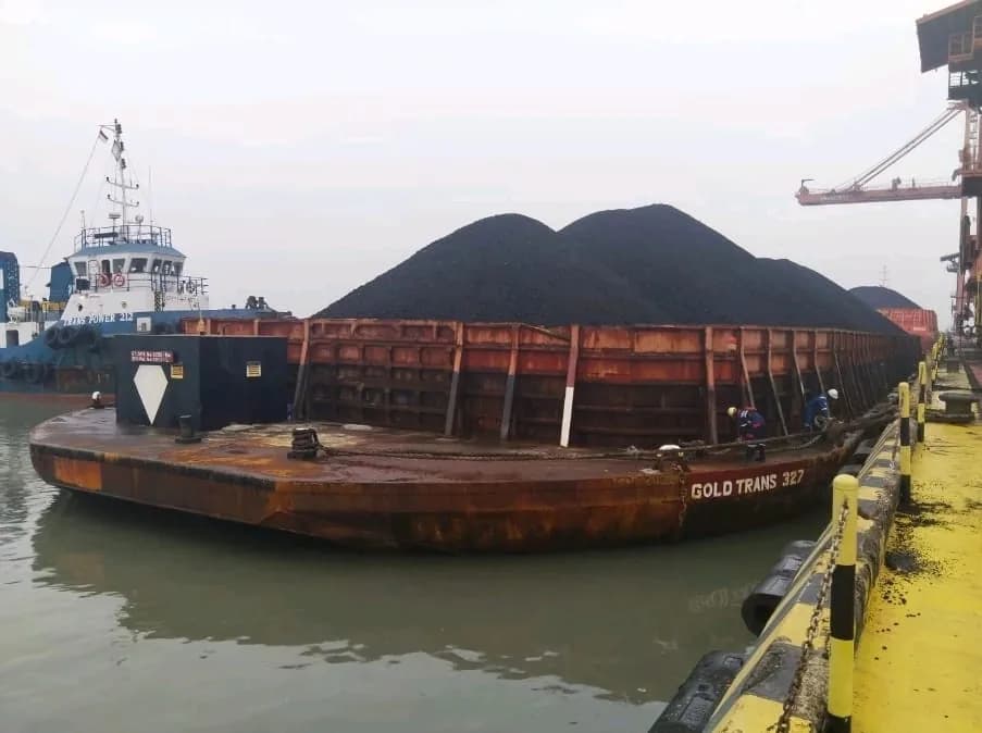 Gold Trans 327 loaded barge at a terminal
